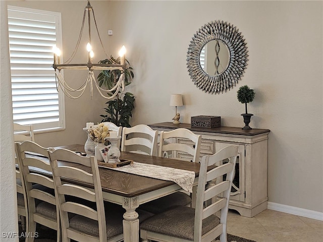 dining space featuring a notable chandelier and light tile patterned floors