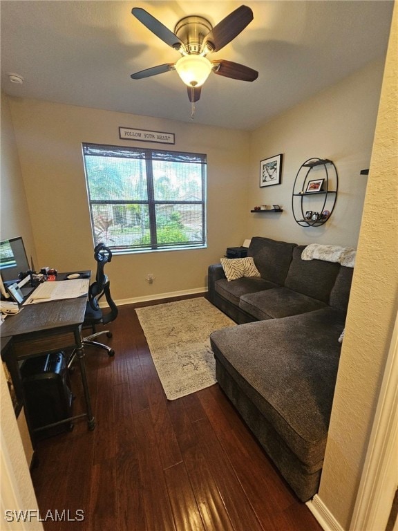 office space with dark wood-type flooring and ceiling fan