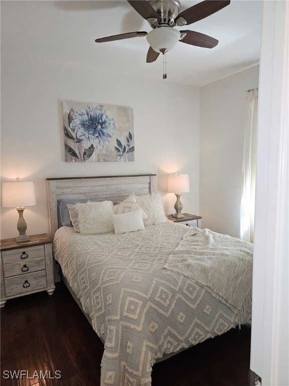 bedroom with dark wood-type flooring and ceiling fan