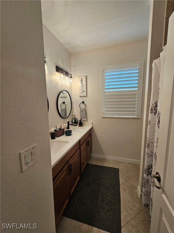 bathroom with vanity and tile patterned flooring