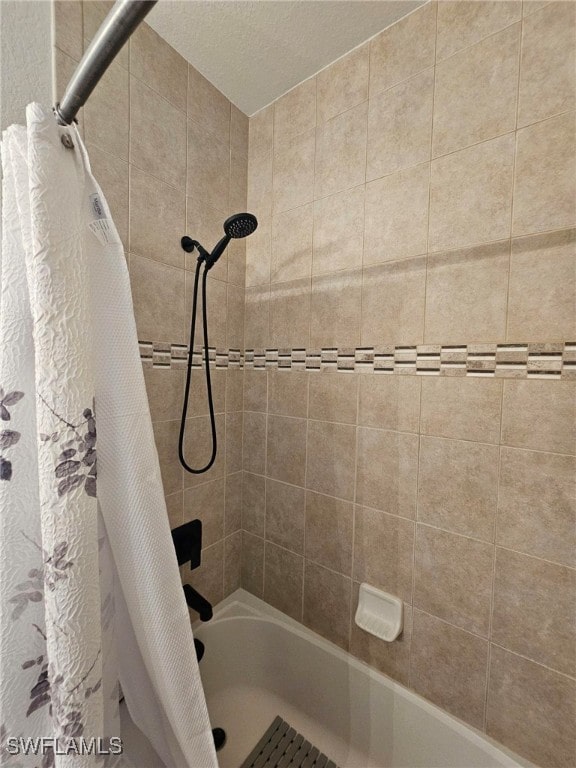 bathroom featuring shower / bath combination with curtain