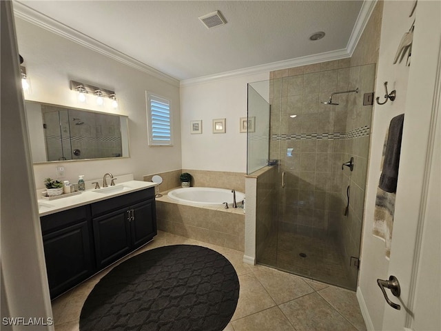 bathroom featuring tile patterned floors, crown molding, vanity, shower with separate bathtub, and a textured ceiling