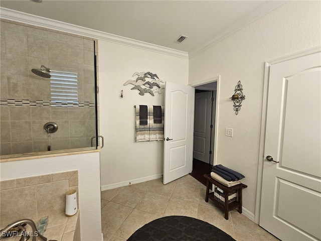 bathroom featuring ornamental molding, tile patterned floors, a textured ceiling, and walk in shower