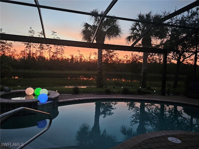 pool at dusk with glass enclosure