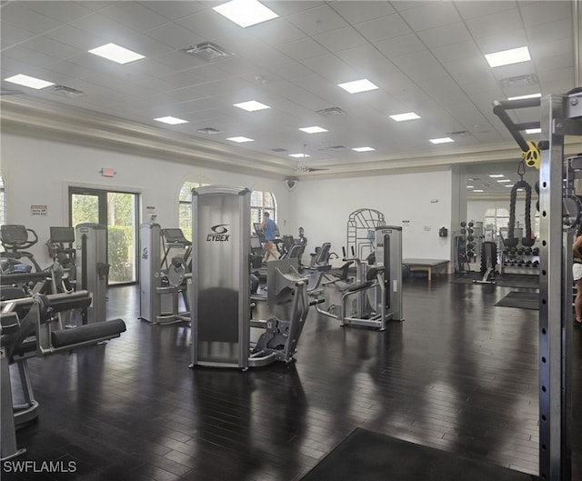 gym with dark wood-type flooring and a drop ceiling