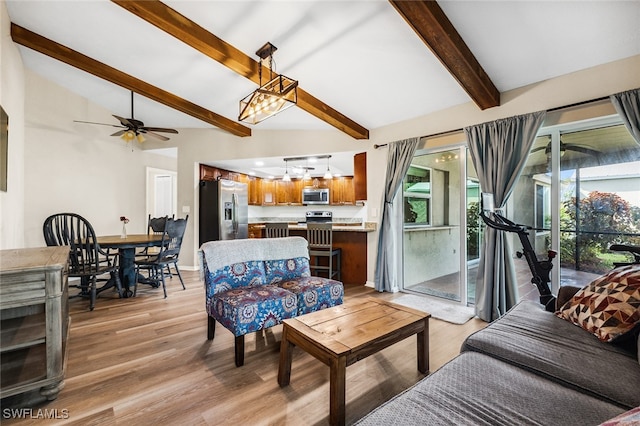 living room featuring vaulted ceiling with beams, ceiling fan, and light hardwood / wood-style flooring