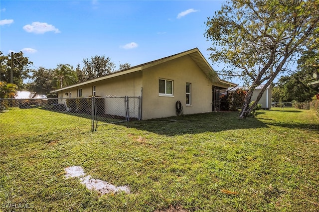 view of home's exterior with a yard