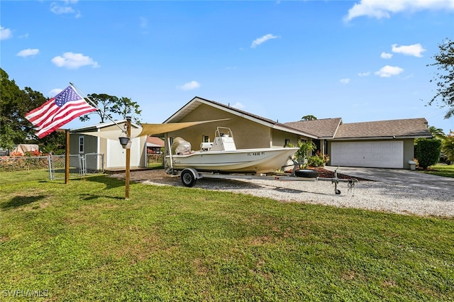 view of front facade featuring a garage and a front yard