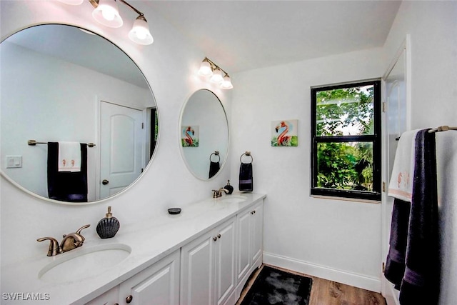 bathroom with hardwood / wood-style floors and vanity