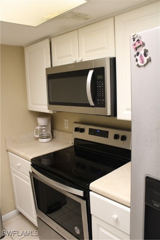 kitchen featuring white cabinetry and appliances with stainless steel finishes