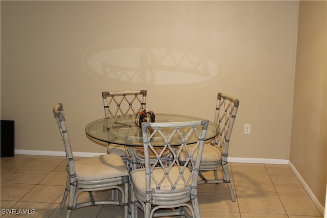 dining area featuring light tile patterned floors