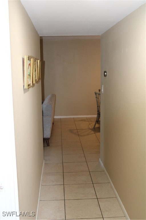 corridor with light tile patterned floors