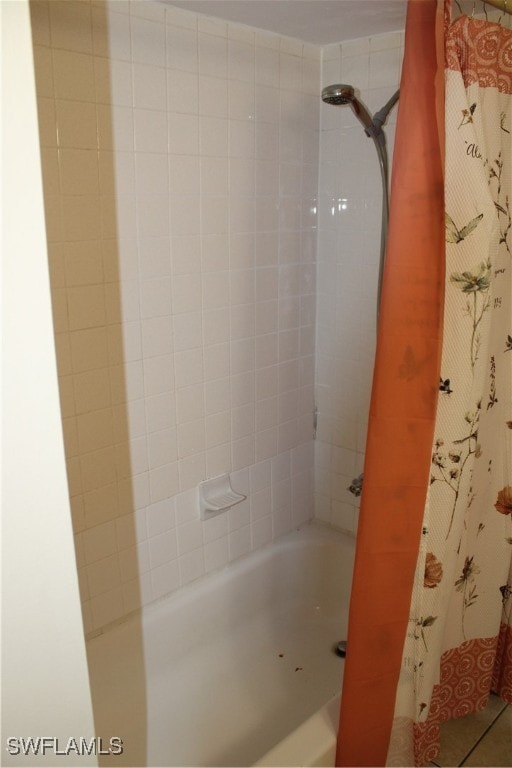 bathroom with shower / tub combo with curtain