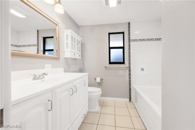 bathroom featuring vanity, toilet, and tile patterned flooring