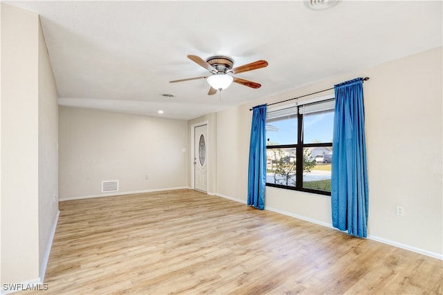 unfurnished room featuring light hardwood / wood-style flooring and ceiling fan