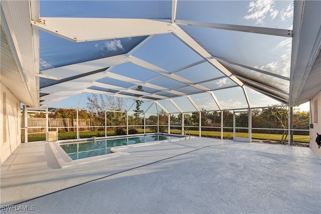 view of pool with a patio and a lanai