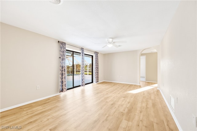 empty room with light wood-type flooring and ceiling fan