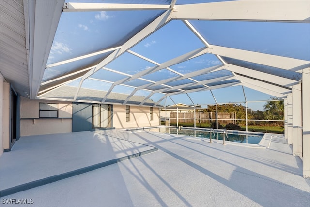 view of patio / terrace featuring glass enclosure