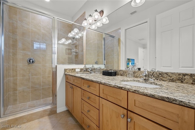 bathroom with vanity, walk in shower, and tile patterned floors