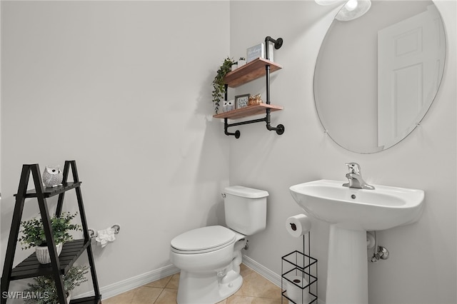 bathroom featuring tile patterned floors and toilet