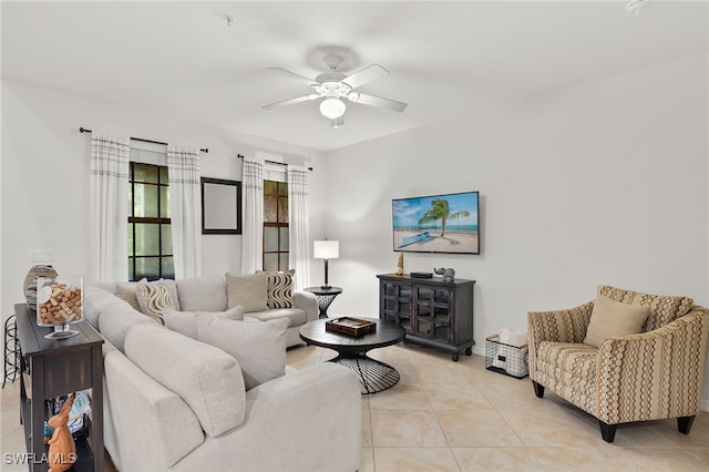 living room with ceiling fan and light tile patterned flooring