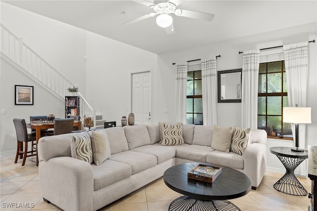 tiled living room featuring ceiling fan