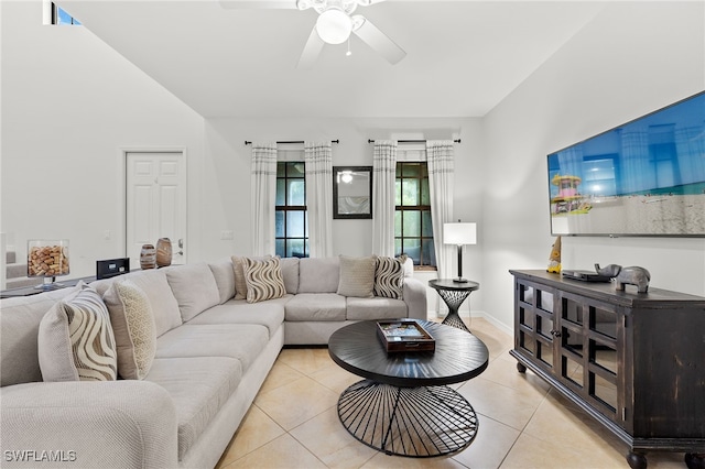 living room with ceiling fan and light tile patterned floors