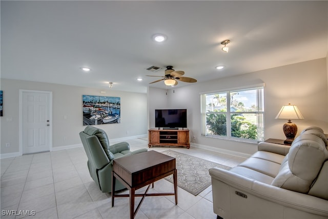 tiled living room featuring ceiling fan