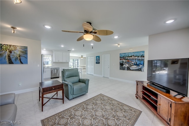 living room with light tile patterned floors and ceiling fan