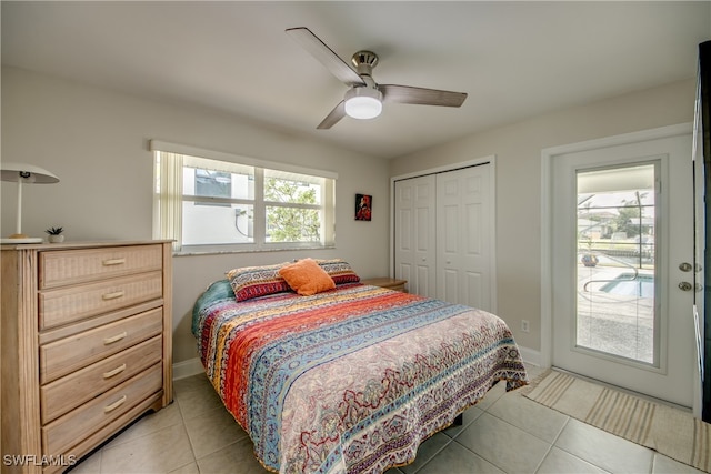 tiled bedroom with a closet and ceiling fan