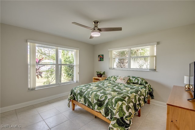 bedroom featuring ceiling fan and light tile patterned flooring