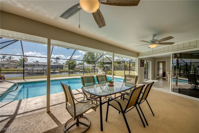 view of pool featuring a patio area, a lanai, and ceiling fan