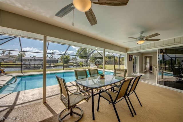 1106 Lorraine Ct, Cape Coral, FL 33904 - outdoor pool with ceiling fan, a patio area, and glass enclosure