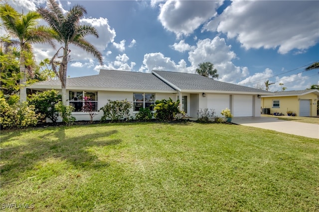 ranch-style house featuring a front yard and a garage