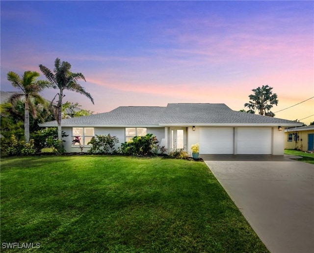 1106 Lorraine Ct, Cape Coral, FL 33904 - ranch-style house with an attached garage, driveway, a front yard, and stucco siding