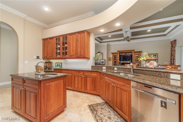 kitchen with dishwasher, crown molding, sink, and dark stone counters