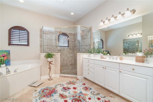 bathroom featuring separate shower and tub, tile patterned floors, and vanity