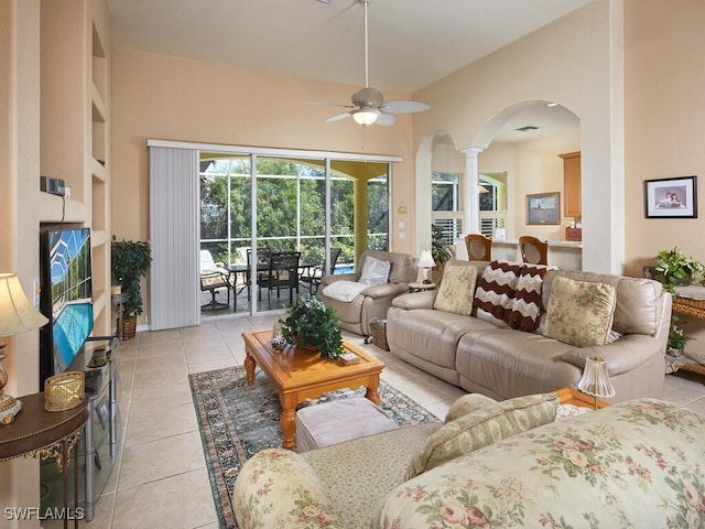 tiled living room with ceiling fan