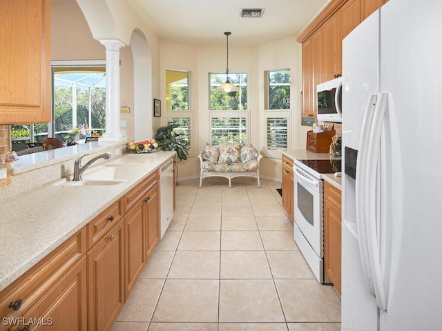 1442 Biscayne Way, Marco Island, FL 34145 - kitchen featuring visible vents, a sink, light countertops, white appliances, and light tile patterned flooring