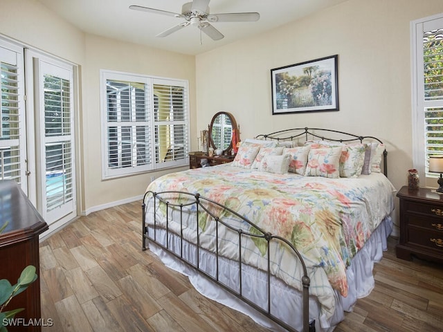 1442 Biscayne Way, Marco Island, FL 34145 - bedroom featuring baseboards, a ceiling fan, wood finished floors, and access to exterior