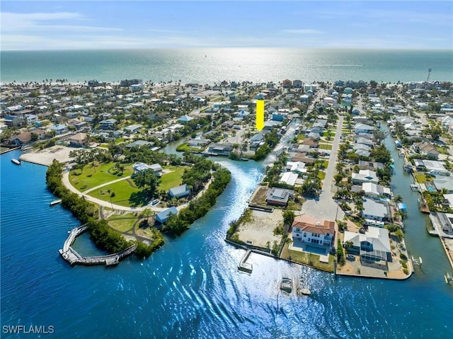 drone / aerial view featuring a residential view and a water view