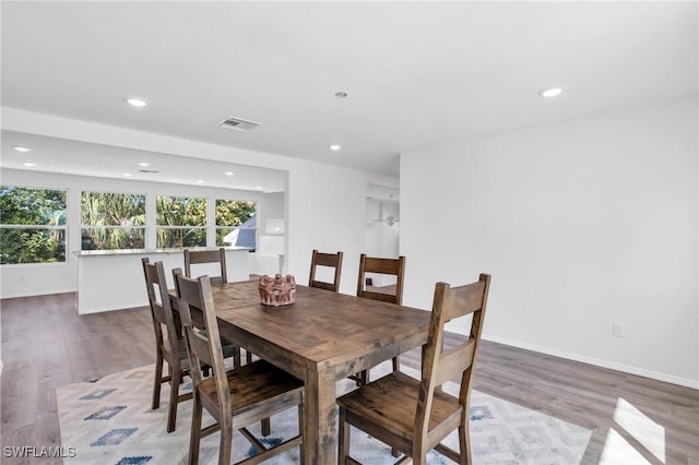 dining room featuring recessed lighting, visible vents, and wood finished floors