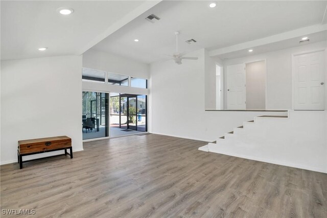 unfurnished living room featuring light wood-style floors, baseboards, visible vents, and a ceiling fan