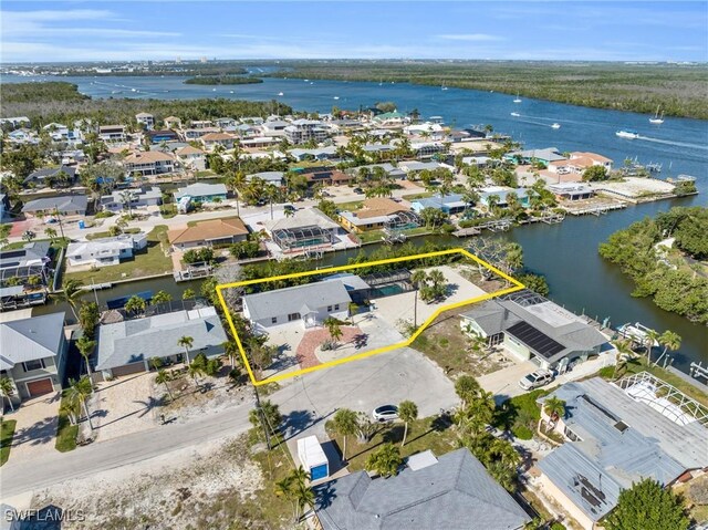 drone / aerial view featuring a residential view and a water view