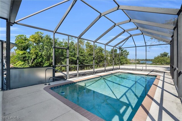 pool featuring a lanai and a patio