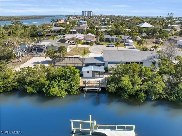 bird's eye view with a water view and a residential view