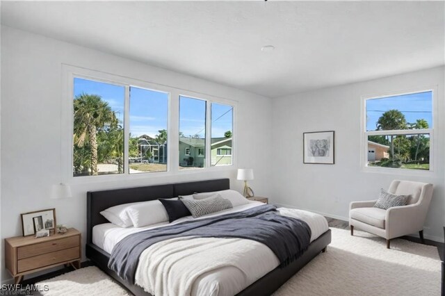 bedroom featuring baseboards