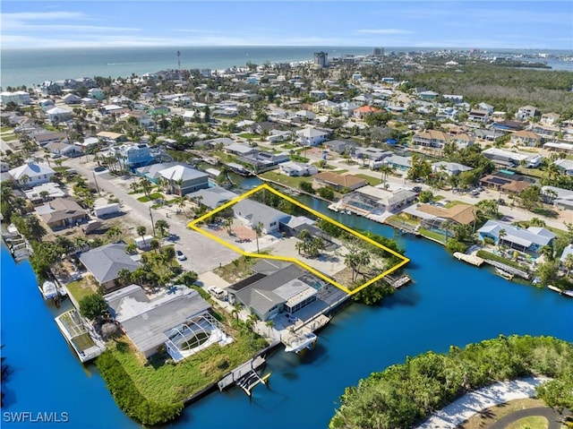 aerial view with a water view and a residential view