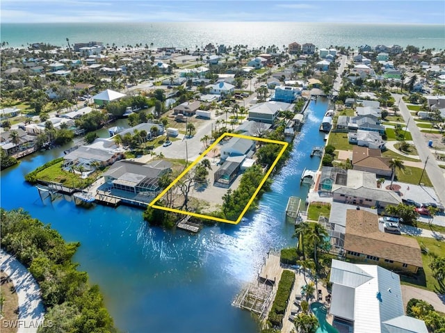 aerial view with a residential view and a water view