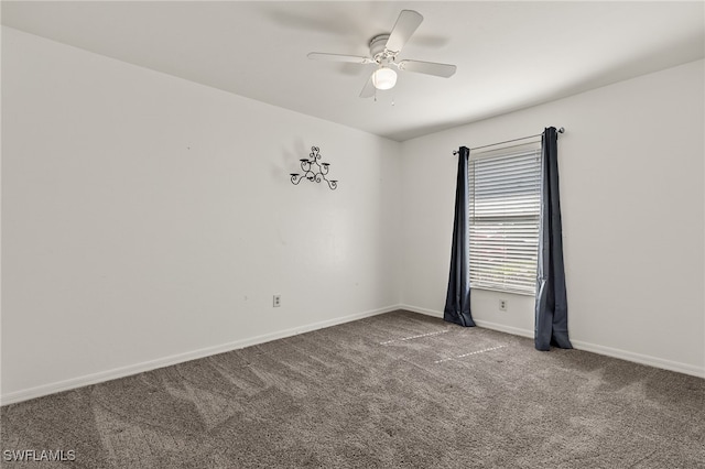 unfurnished room featuring ceiling fan and carpet floors